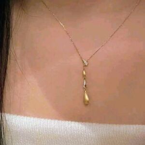 Teardrop pendant necklace with sparkling rhinestones; brushed metal; nwot